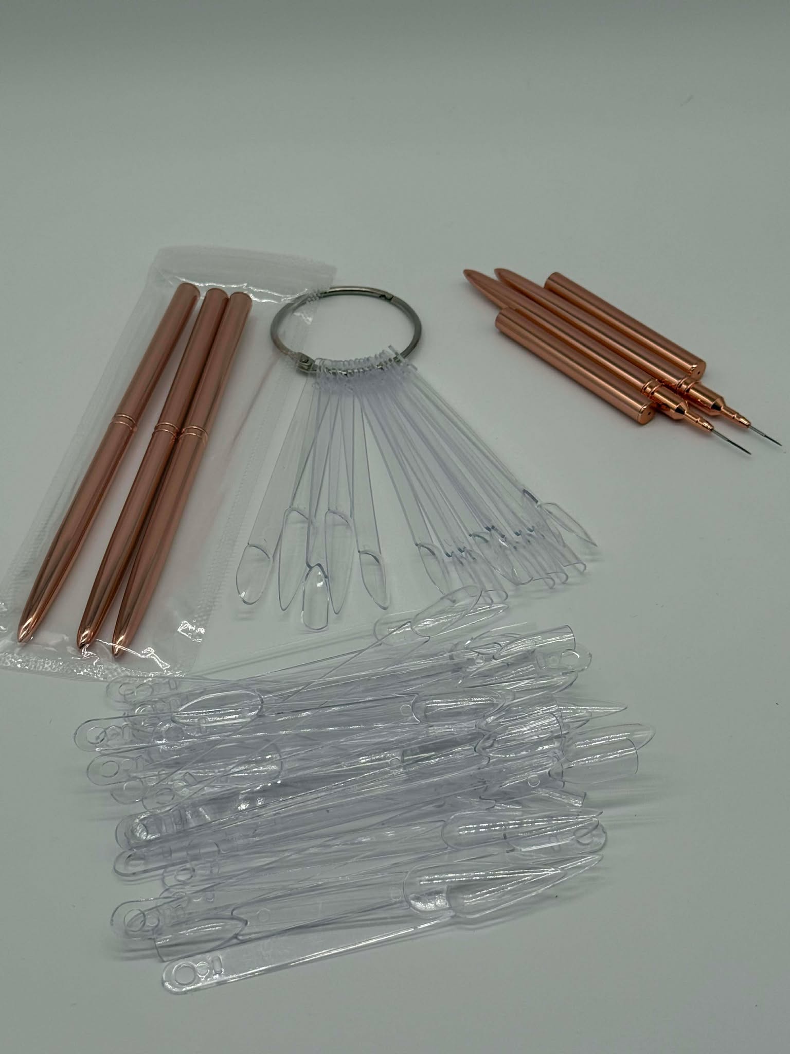 Nail art brushes with plastic practice nails