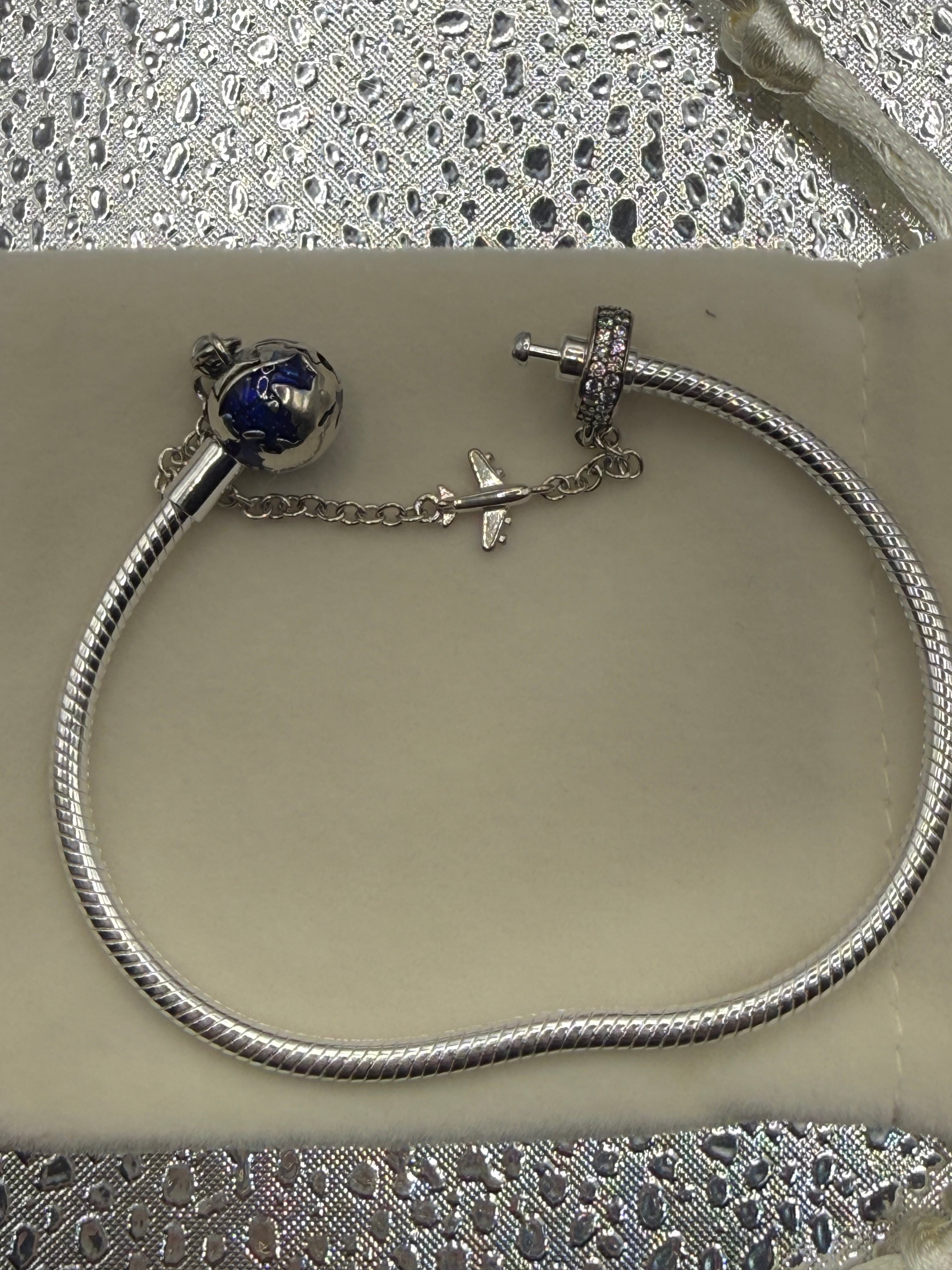 Sterling silver globe and plane charm bracelet